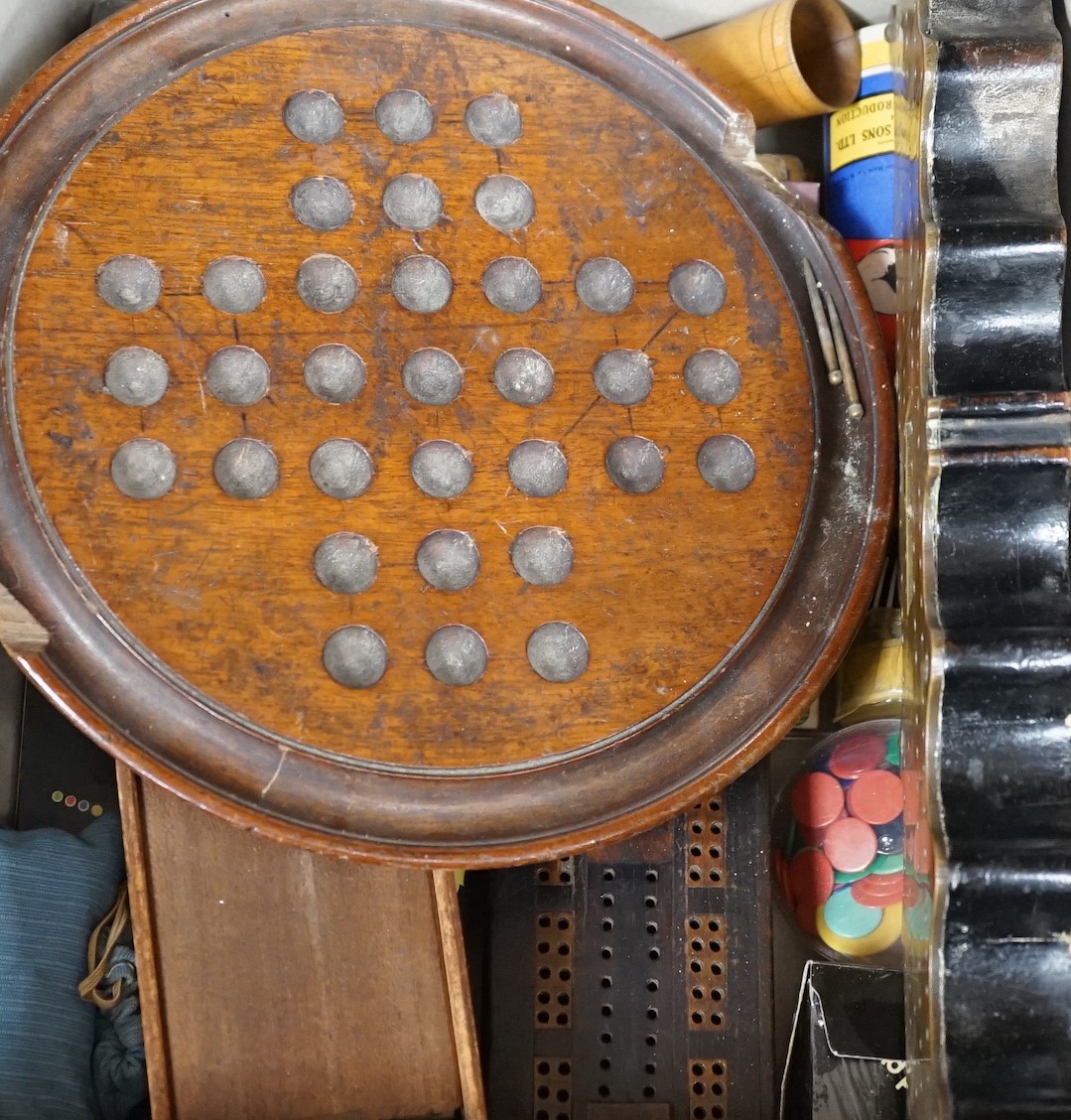 A selection of various games, to include a cribbage board, cards etc.